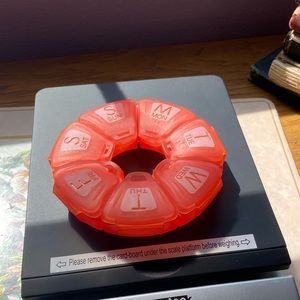 pink medication holder